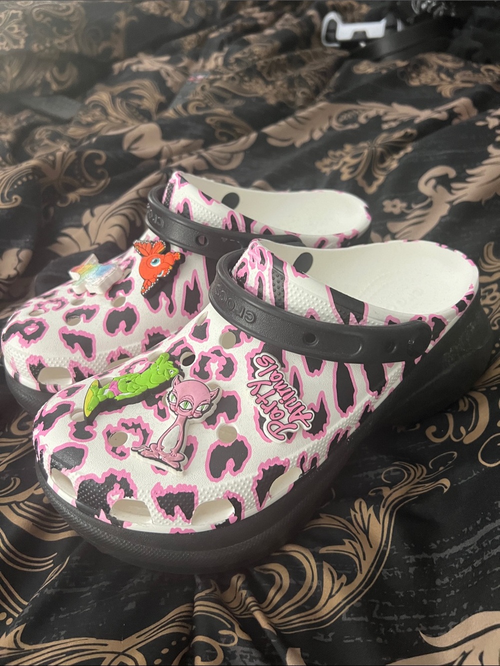 CROCS Women’s Pink Leopard Print Clogs with Black Strap and Charms
